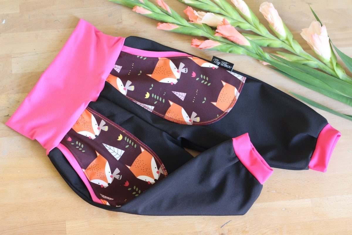 Black softshell trousers, pink foxes