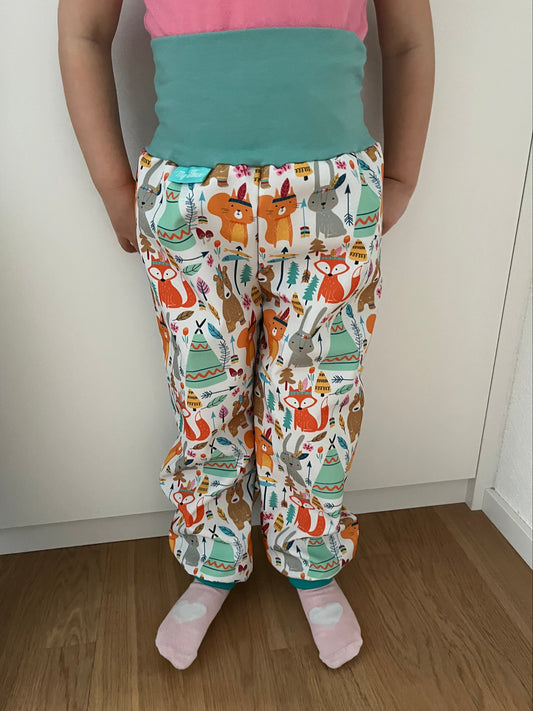 Softshell trousers with animals while camping, white